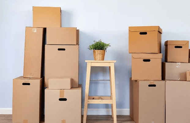 Neatly packed moving boxes organized and ready to load in South Florida home