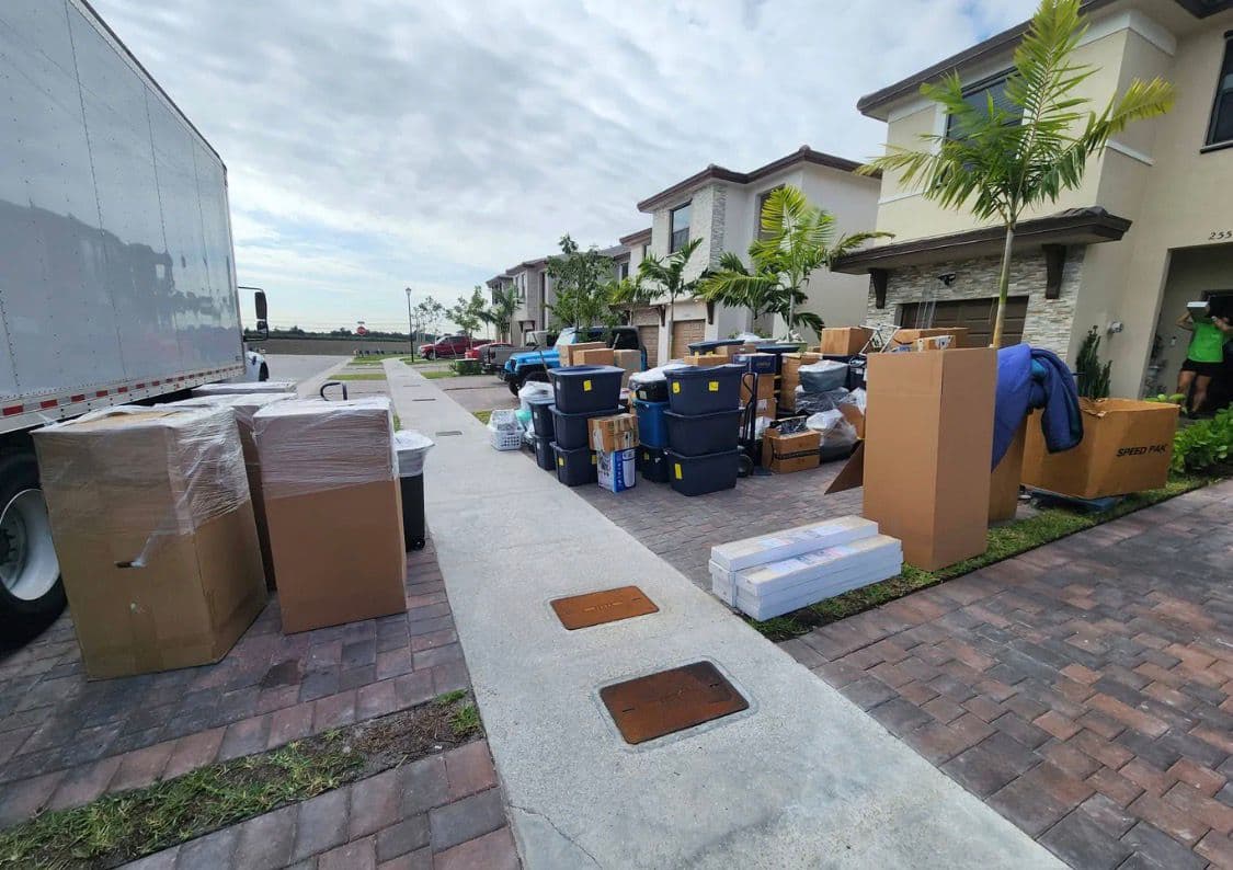 EasyMove Elite moving truck and crew outside South Florida home during full residential move